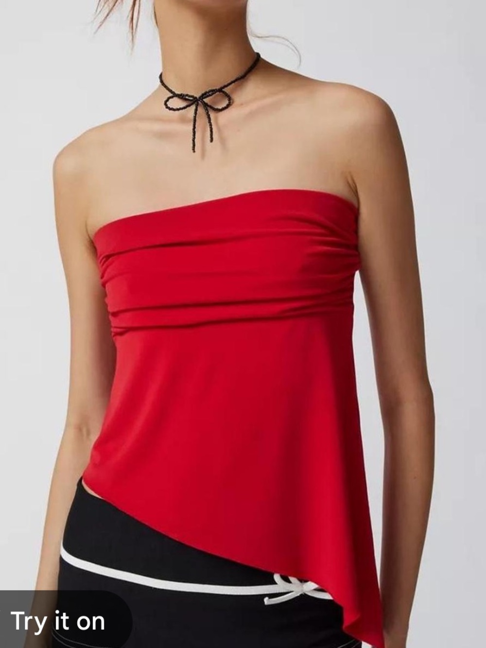 Urban Outfitters strapless asymmetrical tube top in a vibrant red shade